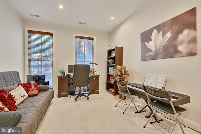 carpeted office space with baseboards, visible vents, and recessed lighting