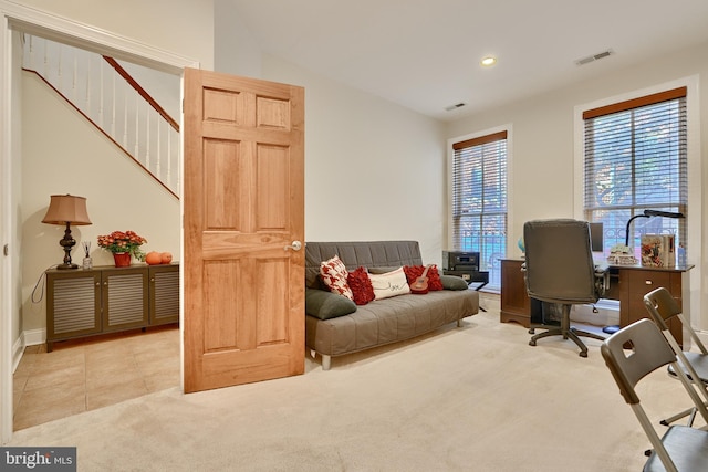 carpeted office with tile patterned flooring, visible vents, and recessed lighting