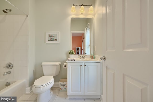 full bathroom featuring toilet, vanity, baseboards, tub / shower combination, and tile patterned floors