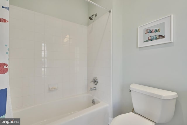 full bath featuring toilet and shower / bath combo with shower curtain