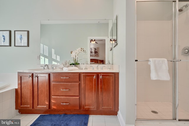 bathroom featuring a stall shower and a sink