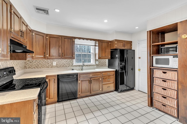 kitchen with visible vents, a sink, under cabinet range hood, black appliances, and open shelves