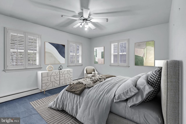 carpeted bedroom featuring multiple windows and ceiling fan