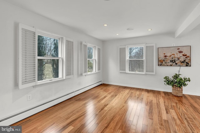 unfurnished room featuring recessed lighting, a baseboard radiator, baseboards, and hardwood / wood-style flooring