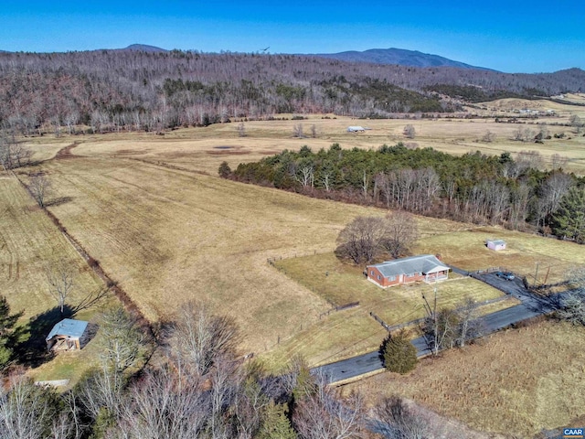 drone / aerial view with a mountain view and a rural view