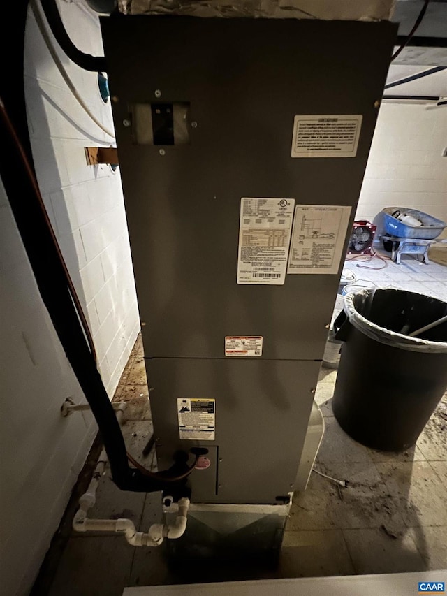 utility room with heating unit