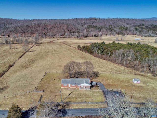 birds eye view of property with a rural view and a view of trees