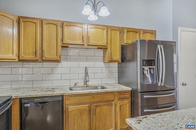 kitchen with dishwasher, backsplash, a sink, and stainless steel fridge