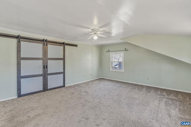 bonus room featuring lofted ceiling, baseboards, a ceiling fan, and carpet flooring