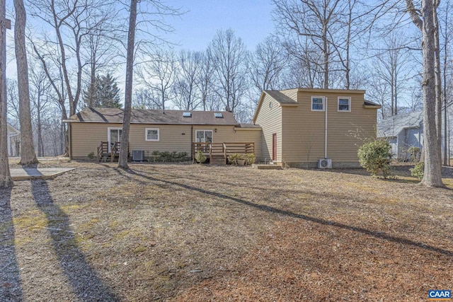 rear view of house featuring a deck and central air condition unit