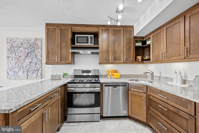 kitchen featuring open shelves, stainless steel appliances, a sink, a textured ceiling, and exhaust hood