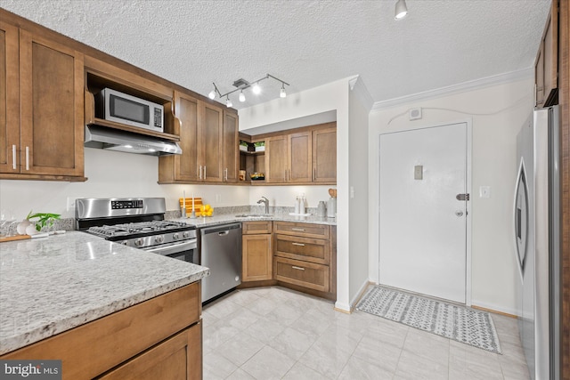 kitchen with open shelves, stainless steel appliances, a sink, light stone countertops, and exhaust hood