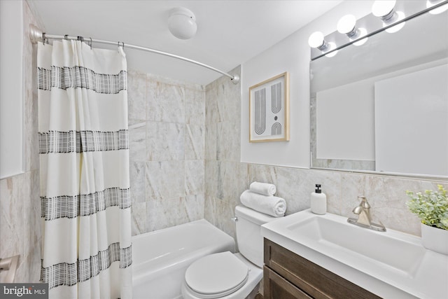 bathroom with toilet, vanity, tile walls, and shower / tub combo with curtain