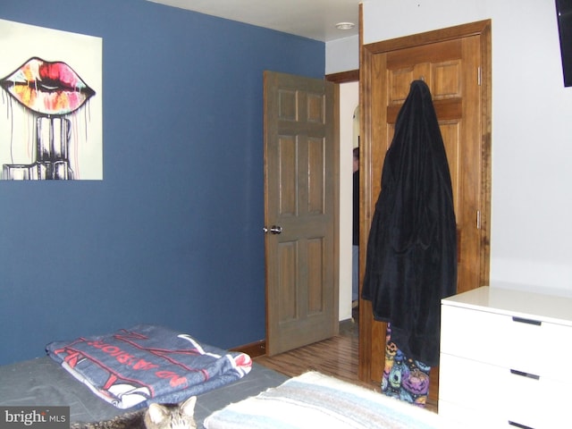 bedroom with wood finished floors