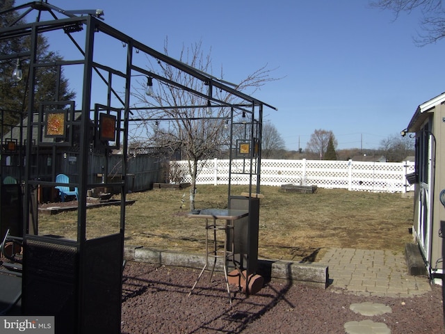 view of yard with a fenced backyard