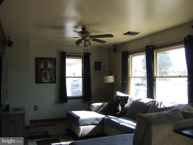 living area featuring ceiling fan