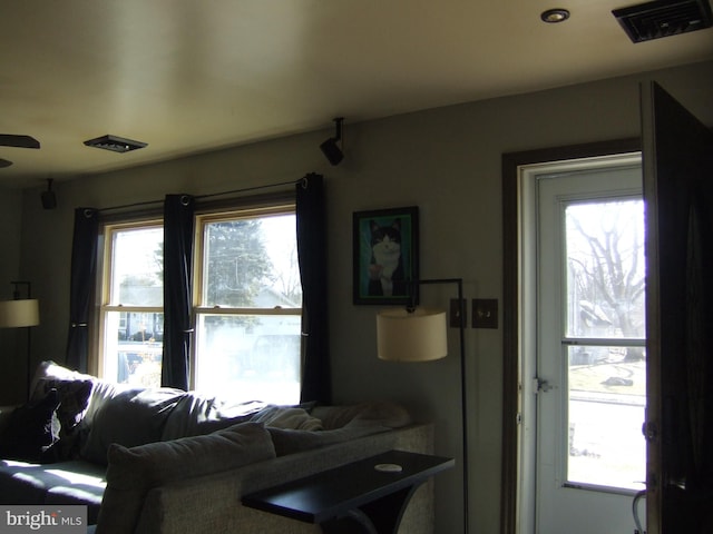 living room featuring visible vents