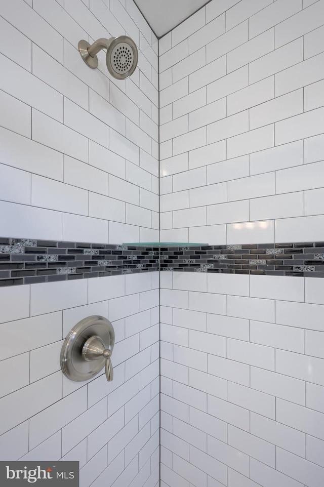 bathroom with a tile shower