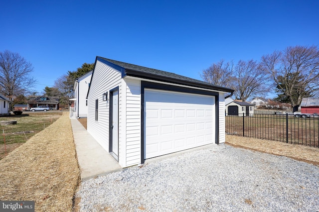 detached garage with fence