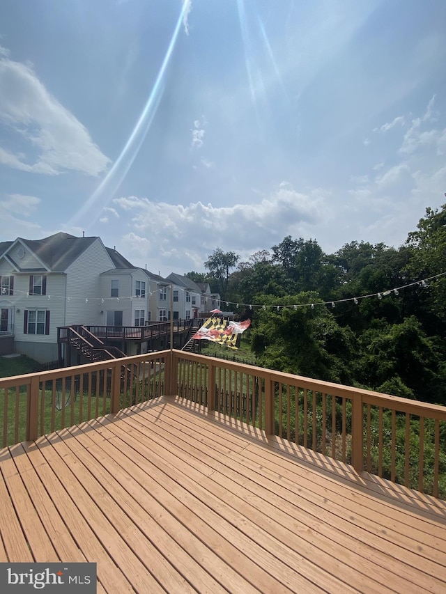 wooden deck featuring a residential view