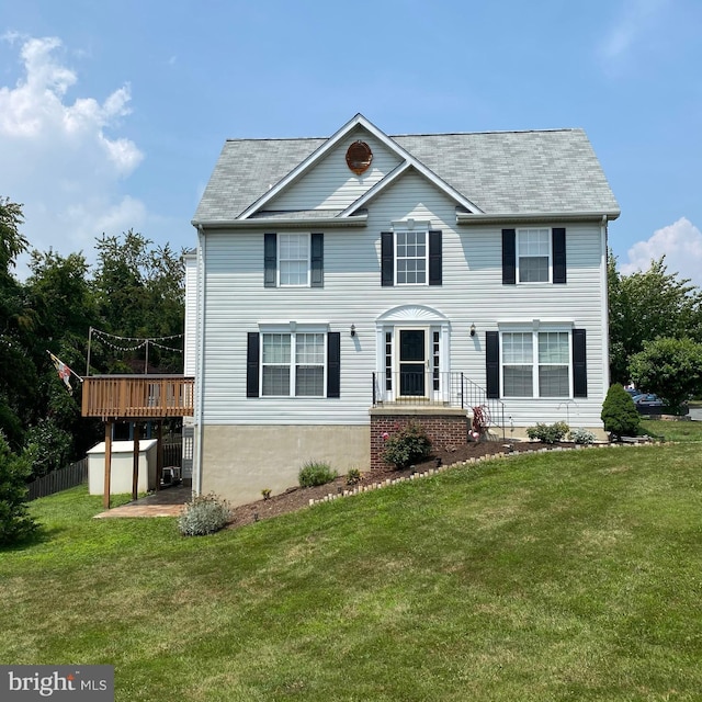 colonial inspired home with a front lawn