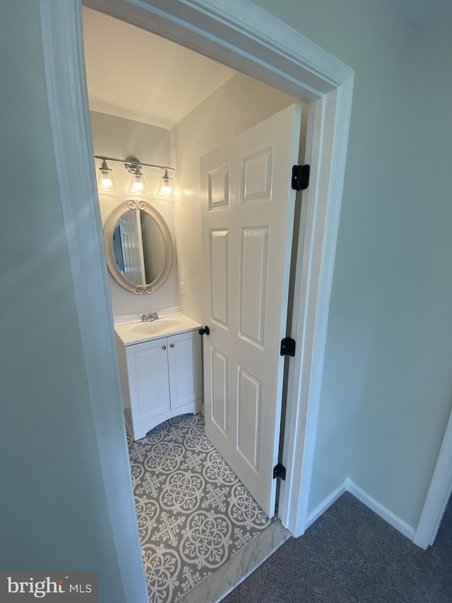 bathroom featuring vanity and baseboards