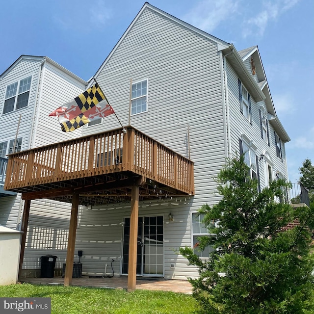 rear view of house with a patio area and a deck