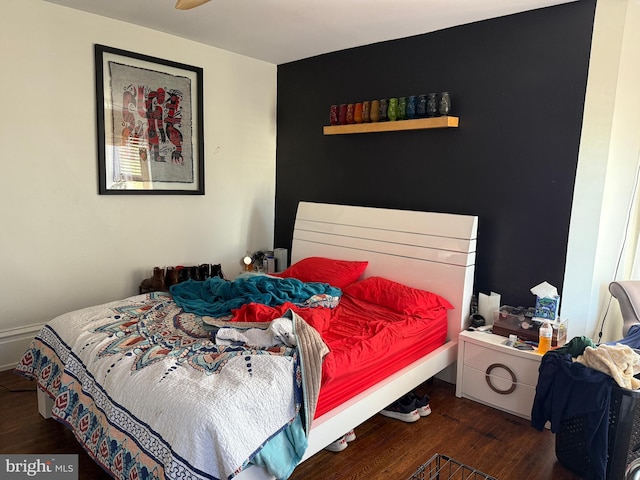 bedroom featuring wood finished floors