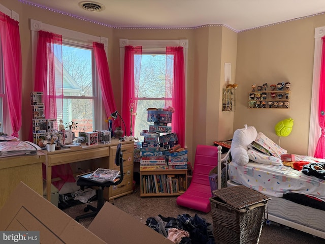 carpeted bedroom with visible vents