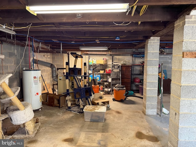 unfinished basement featuring water heater