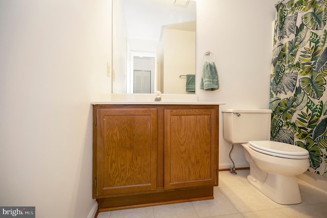 full bath featuring tile patterned flooring, baseboards, vanity, and toilet