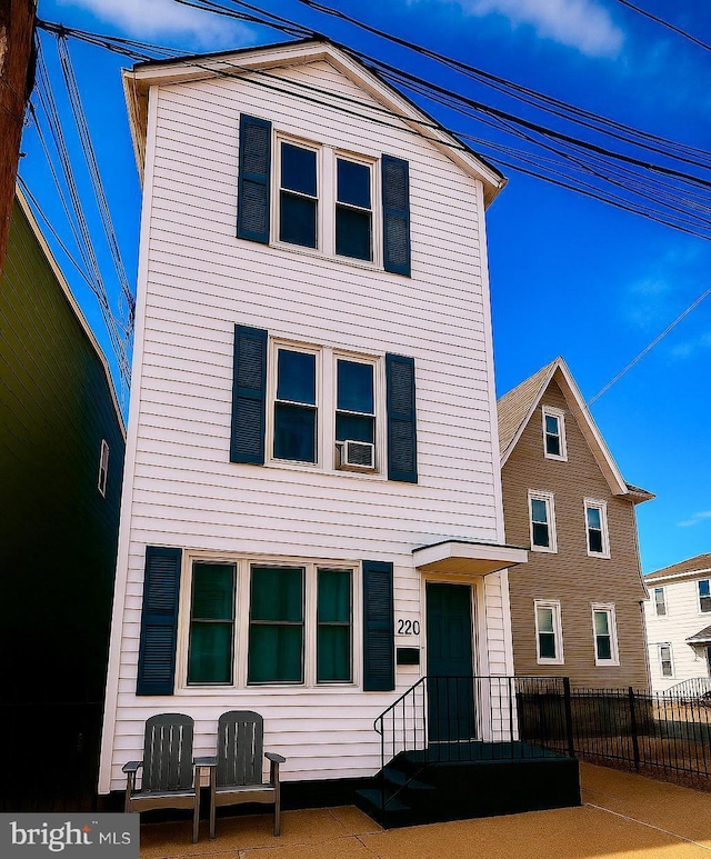 view of front of home with fence