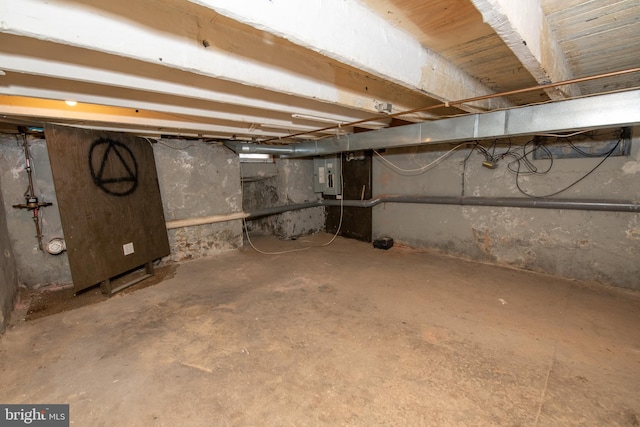 unfinished below grade area with electric panel