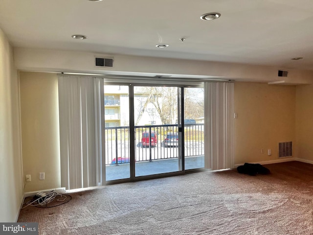 empty room with carpet and visible vents