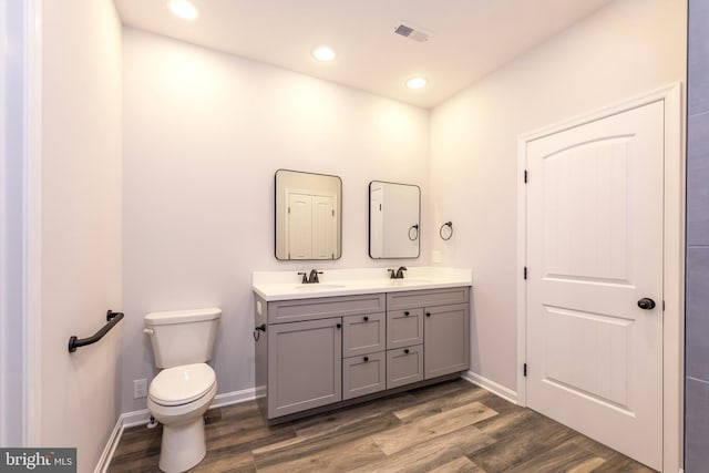 103 Matte Ln, Havre De Grace, MD 21078 - full bathroom with double vanity, toilet, wood finished floors, recessed lighting, and baseboards
