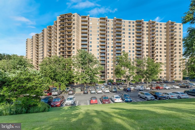 view of property featuring uncovered parking