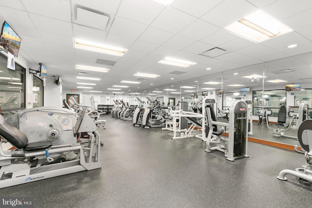 gym featuring a paneled ceiling