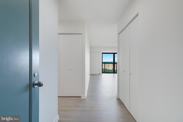 corridor with wood finished floors