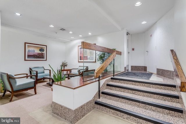 stairway with visible vents and recessed lighting