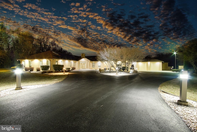 view of street featuring aphalt driveway