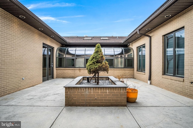 view of patio / terrace featuring an outdoor fire pit