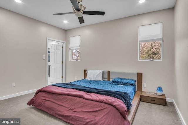 carpeted bedroom with ceiling fan, multiple windows, recessed lighting, and baseboards