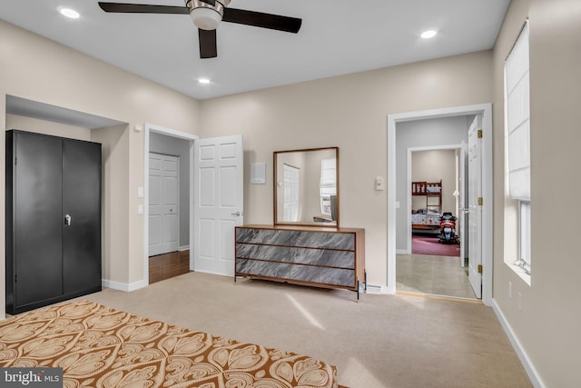 carpeted bedroom featuring ceiling fan, recessed lighting, and baseboards