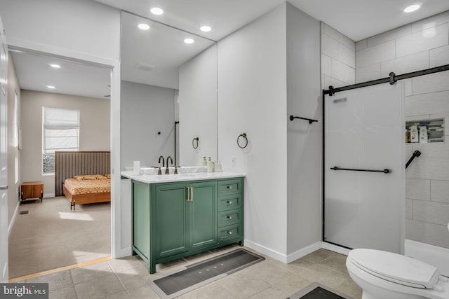 ensuite bathroom with toilet, ensuite bathroom, a shower with shower door, vanity, and recessed lighting