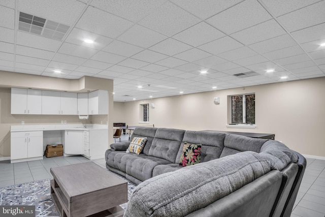 living area featuring recessed lighting, visible vents, and light tile patterned floors