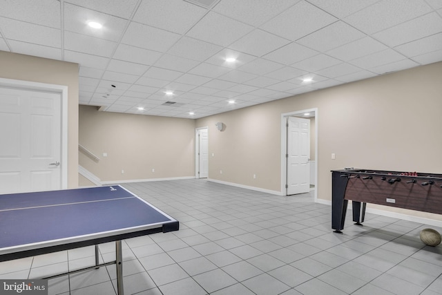 game room with a paneled ceiling, tile patterned flooring, baseboards, and recessed lighting