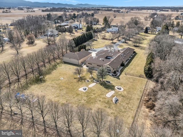 birds eye view of property with a rural view and a mountain view