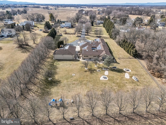 birds eye view of property featuring a rural view