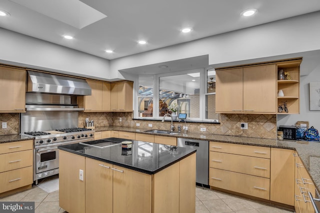 kitchen featuring light tile patterned floors, stainless steel appliances, wall chimney range hood, open shelves, and a sink