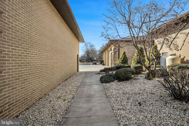 view of home's exterior featuring brick siding